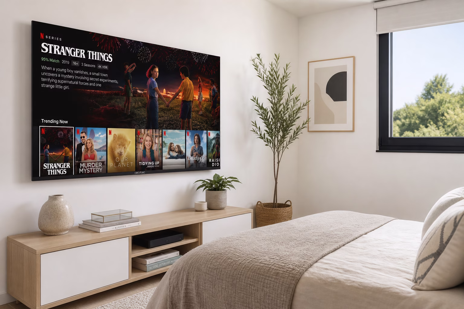Televisor Cecotec ALU20043 de 43 pulgadas 4K UHD montado en pared de dormitorio moderno